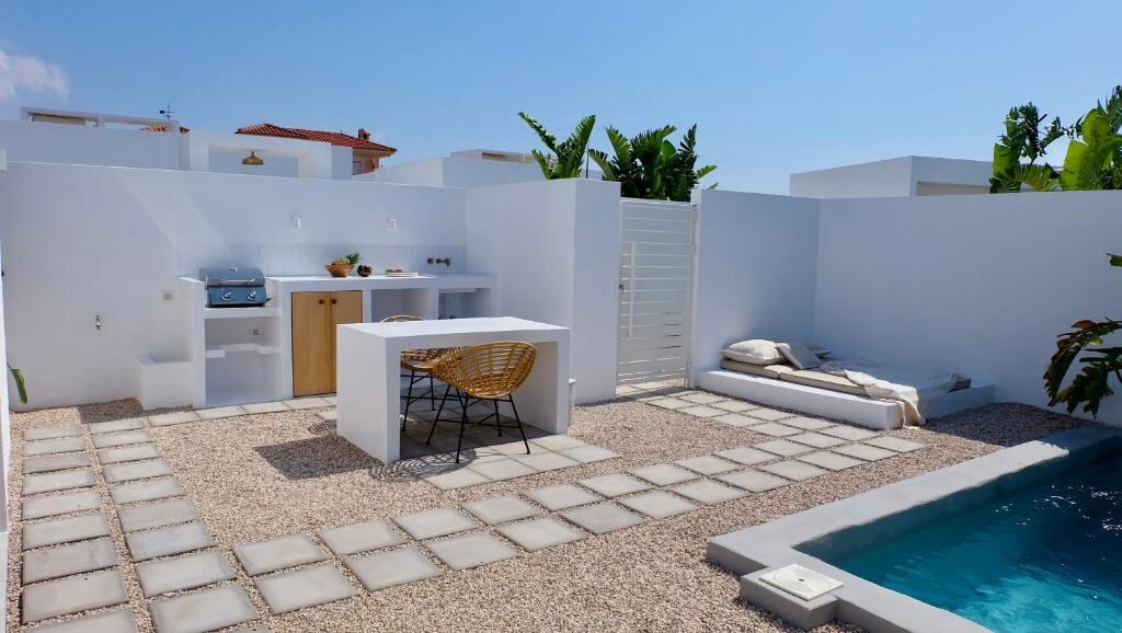 Outdoor kitchen, terrace and pool at EBLI7 Hotel Boutique